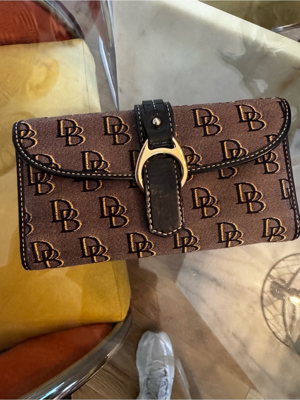 Dooney & Bourke Brown Logo Continental Wallet with Black Strap and Gold Hardware